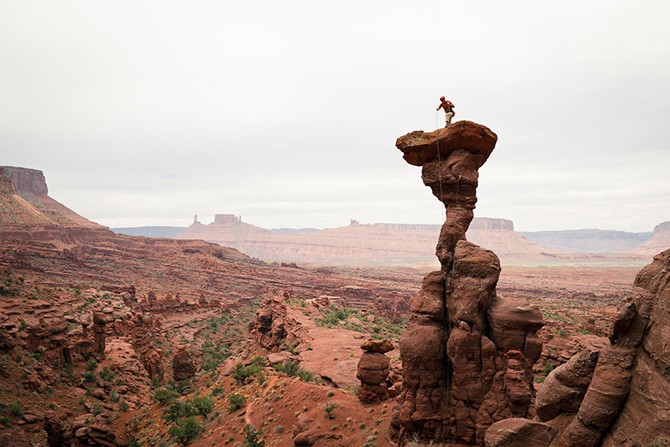 Unknown climber at the top of The Cobra, Fisher Towers, Utah